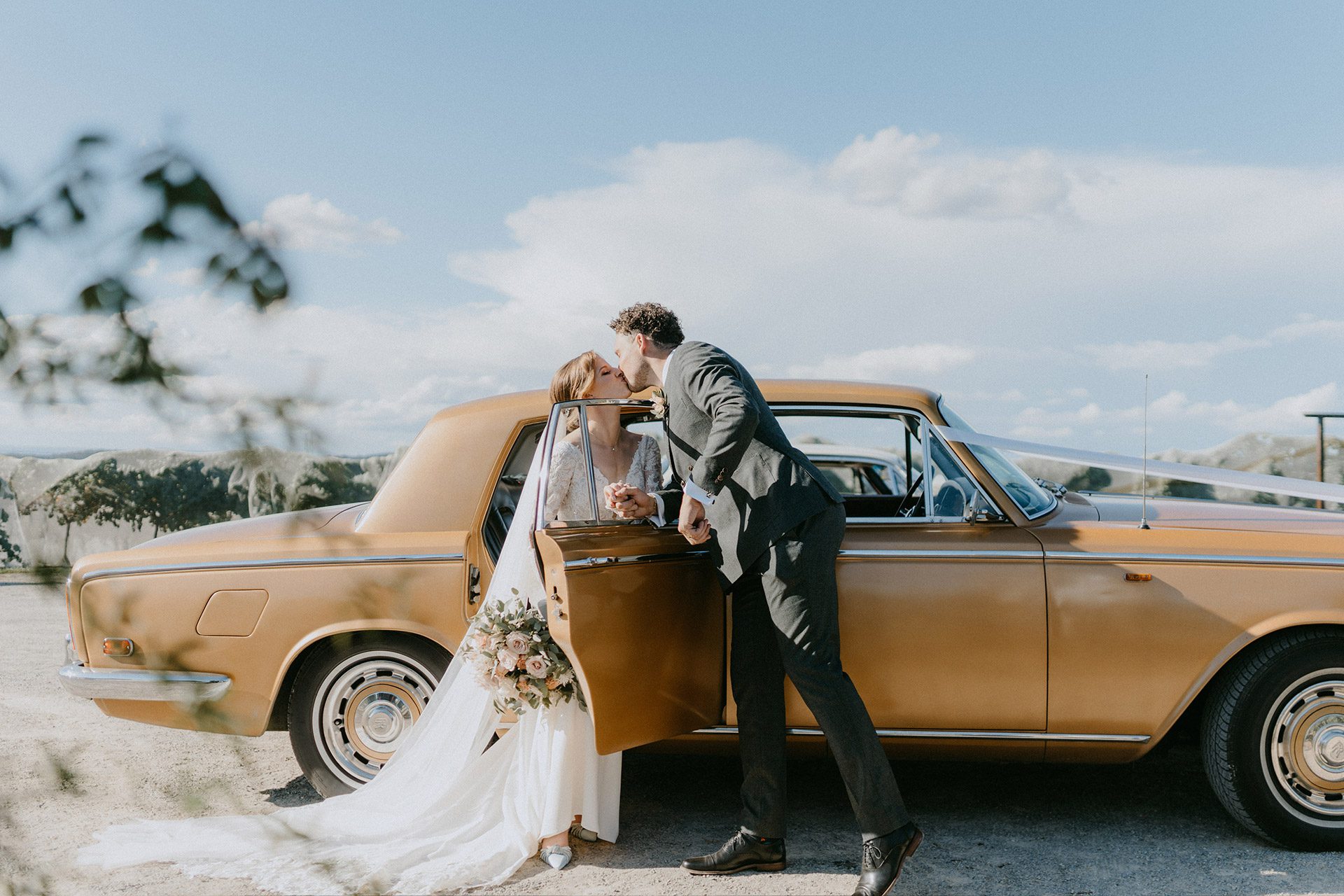 A printed wedding album open on a table